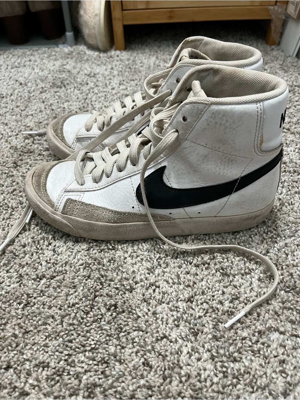 Nike Blazer Mid ’77 Vintage high-top sneakers in the White/Black/Sail colorway
